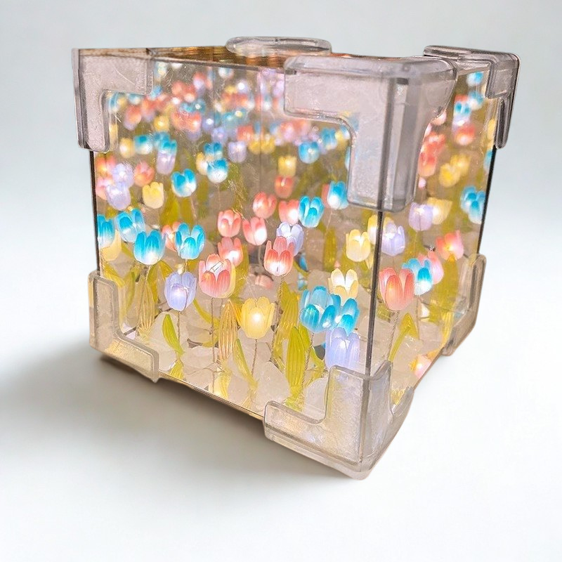 Decorative lamp with colorful floral design on a white background