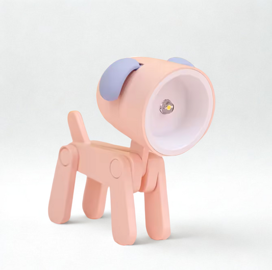 Pink dog-shaped lamp with a light on a white background