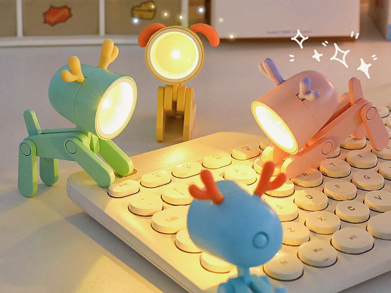 Colorful toy robots with light-up heads on a wooden surface.