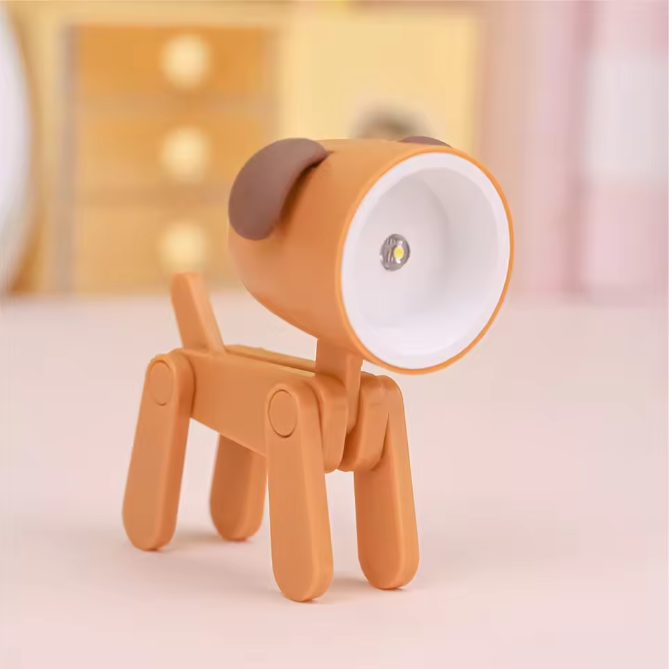 Orange dog-shaped lamp on a soft pink background