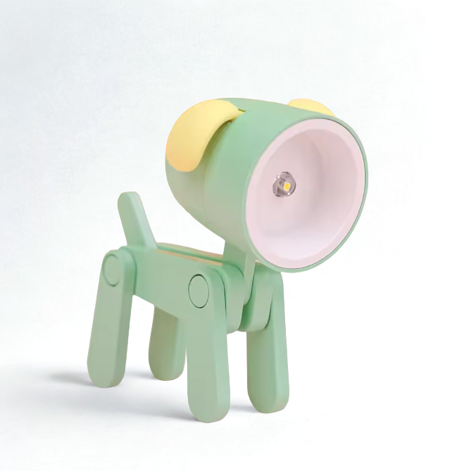 Green and yellow lamp shaped like a dog on a white background