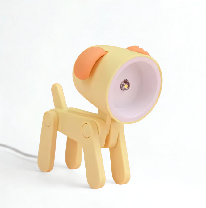 Yellow dog-shaped night light with an orange ear on a white background
