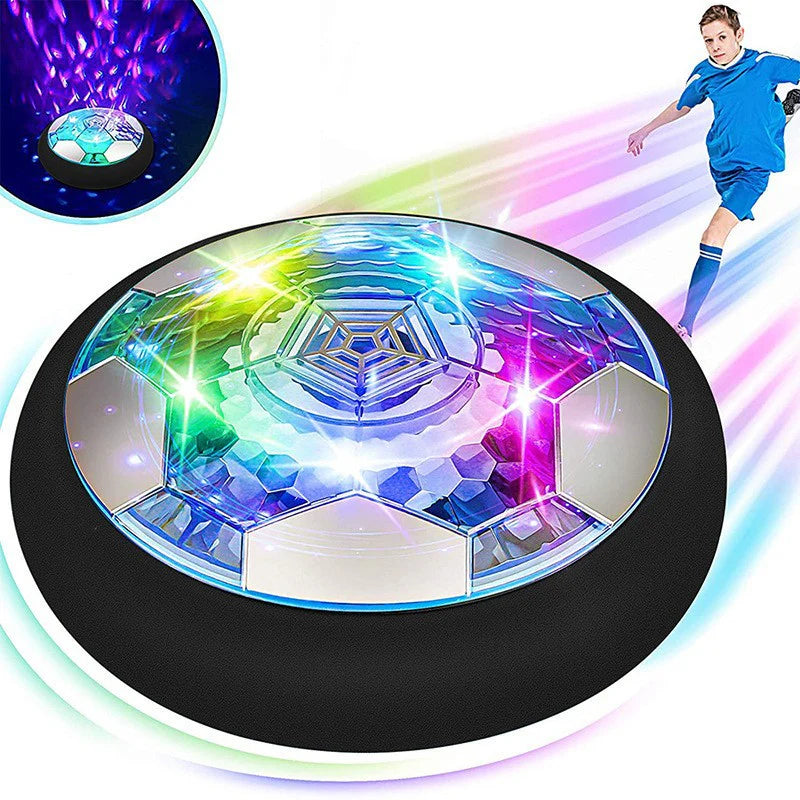 A hover soccer ball with built-in LED lights being played with by a child. The ball is mid-motion, suggesting dynamic play.