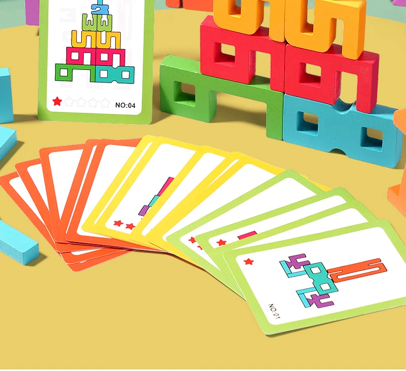 Colorful geometric blocks and card game on a yellow surface
